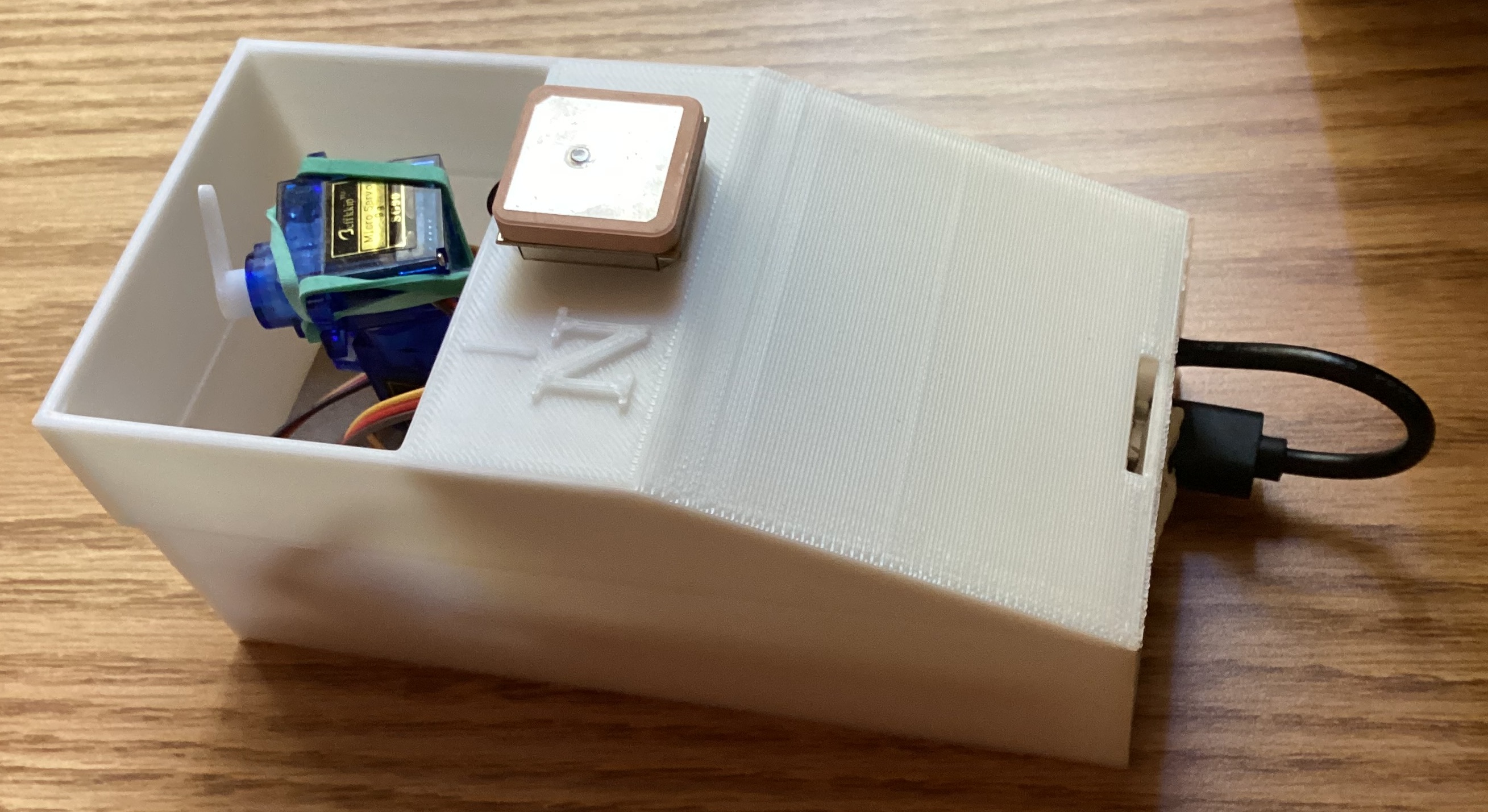 large 3D printed box with GPS antenna resting on top