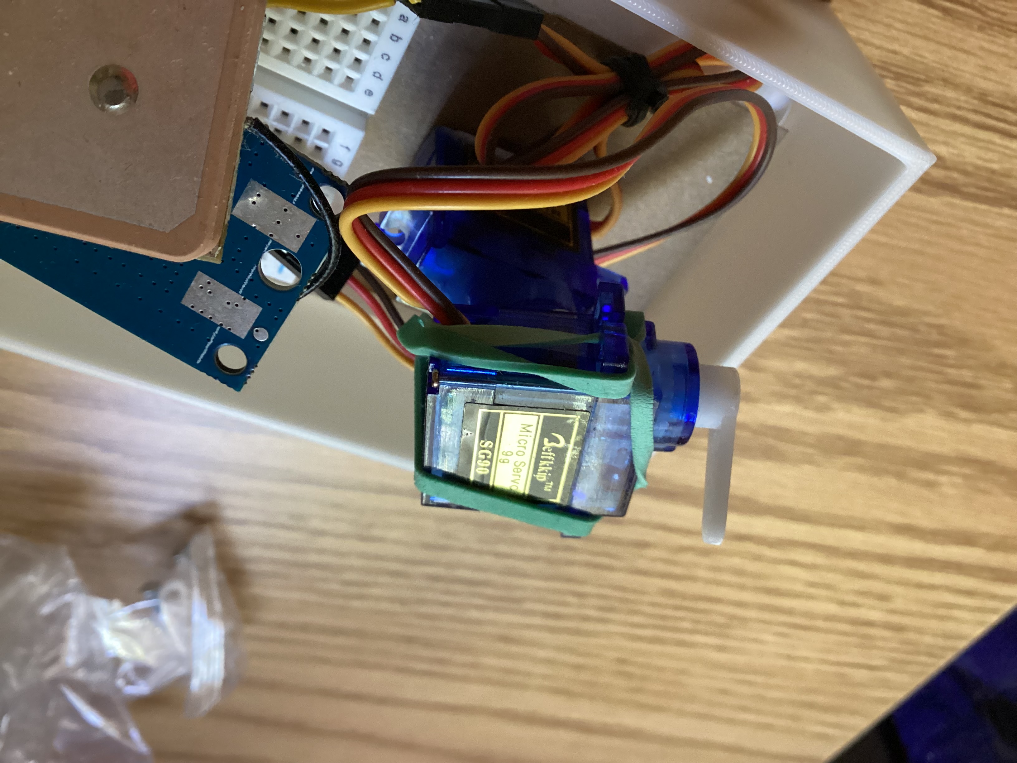 SG90 servos attached with rubber bands to get azimuth and elevation