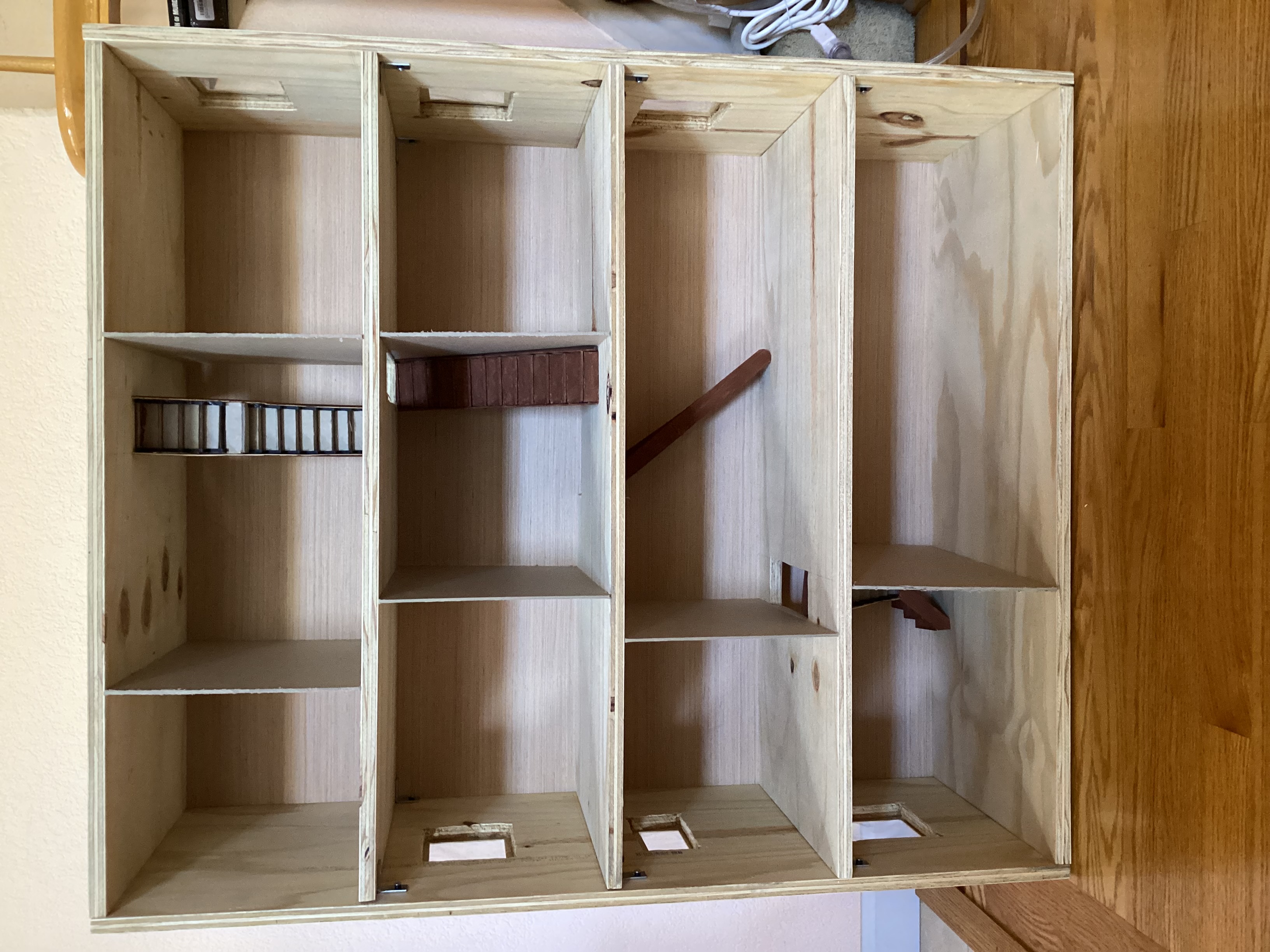 dollhouse with stairs, windows, and interior walls