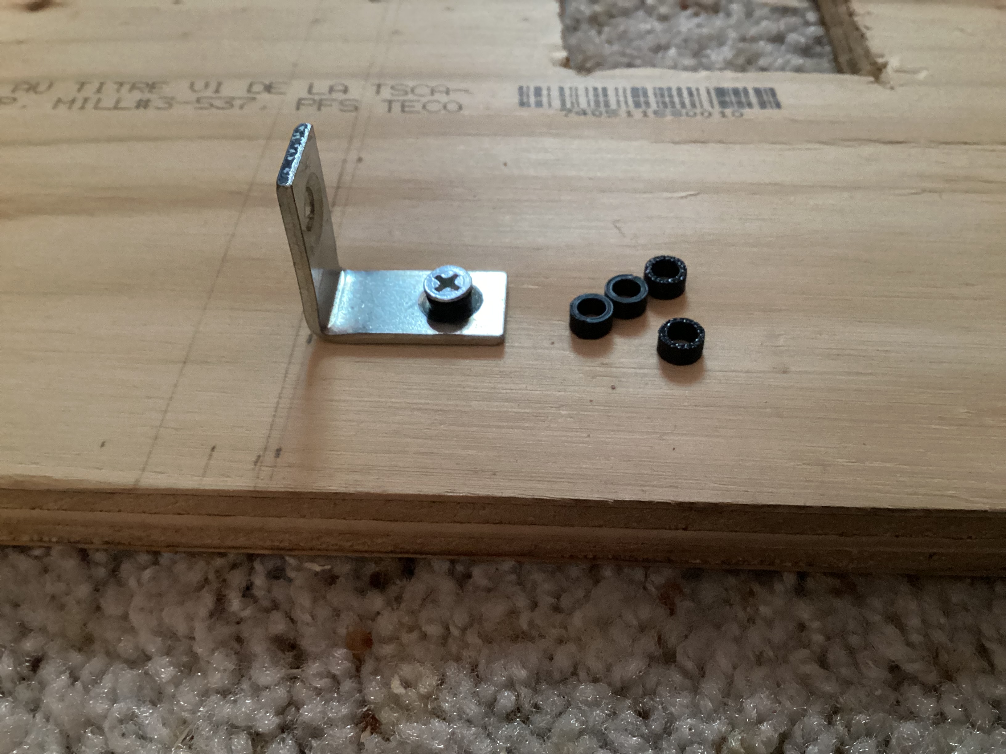 metal bracket next to 3D printed spacers