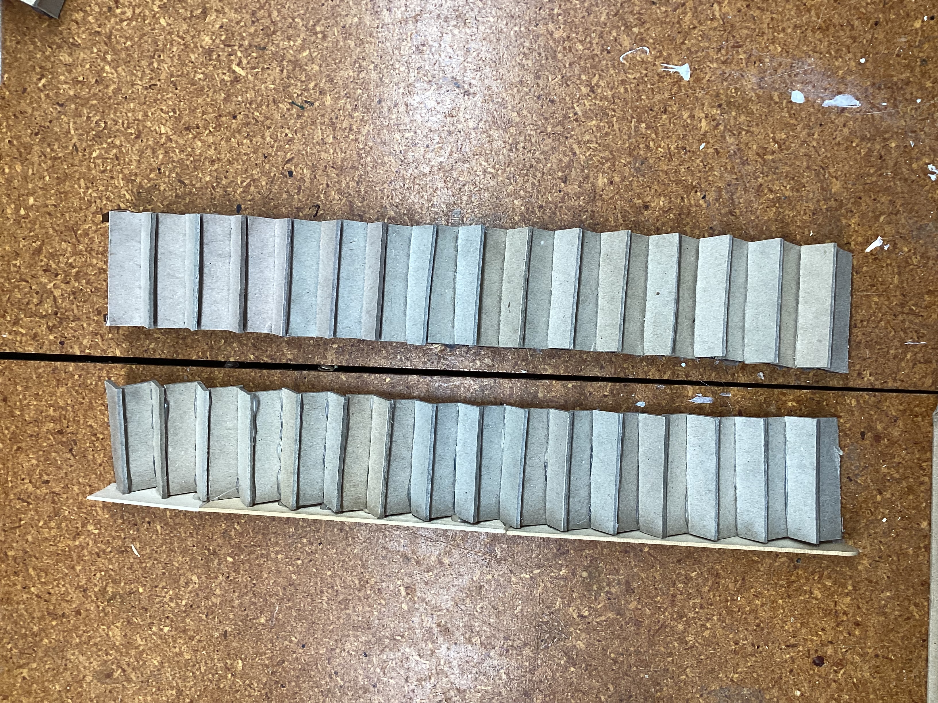 warped original and straighter new attempt side by side