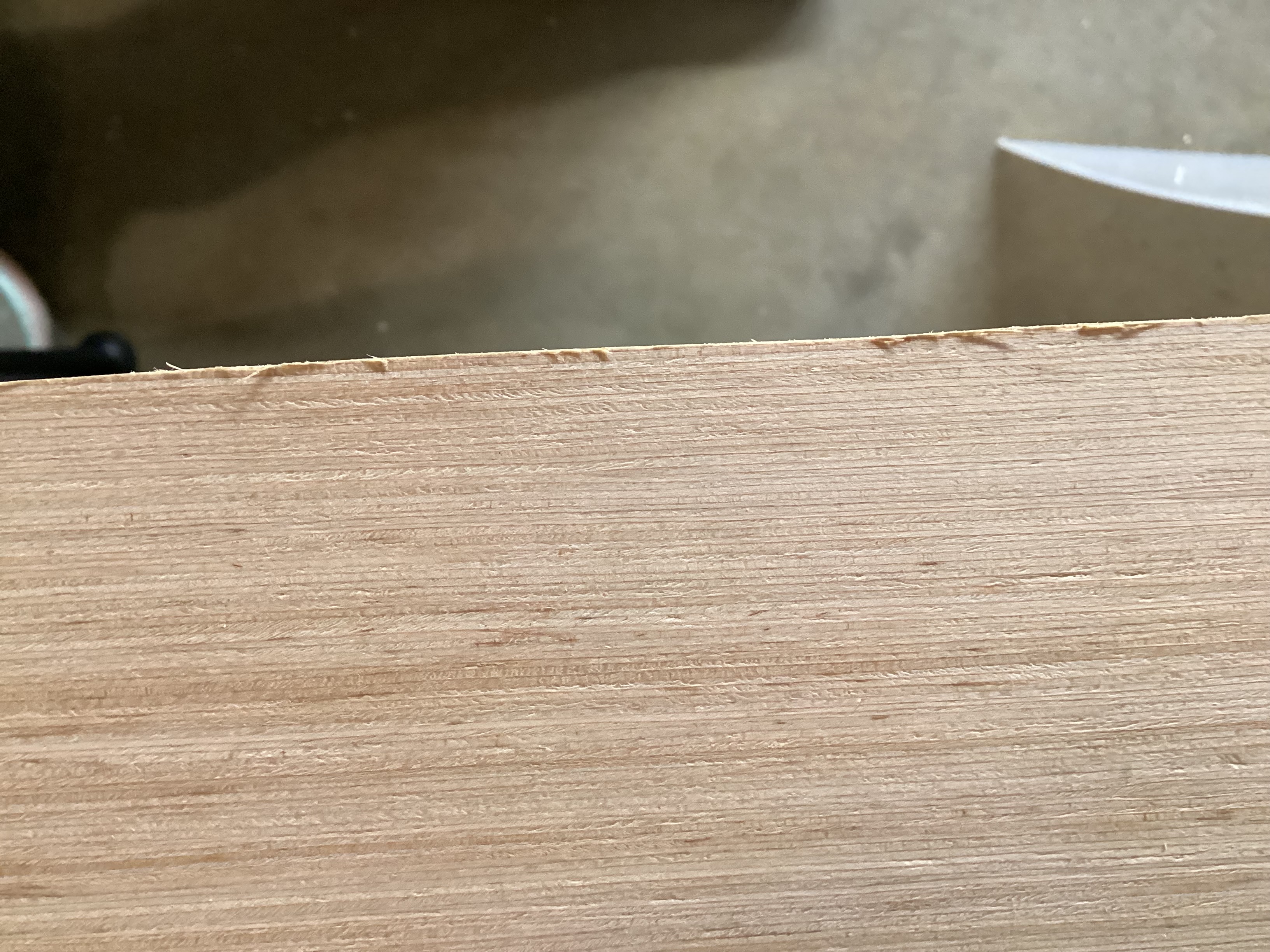 edge of backing, almost perfectly straight